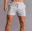 Спортивные короткие шорты для бега и фитнеса цвет светло-серый